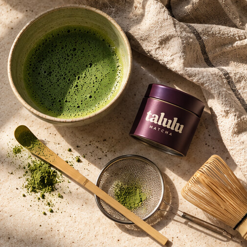 Whisked matcha, a Talulu tin, sifter, scoop and whisk
